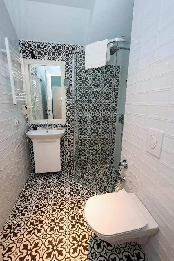 Bathroom with black-and-white patterned tiles